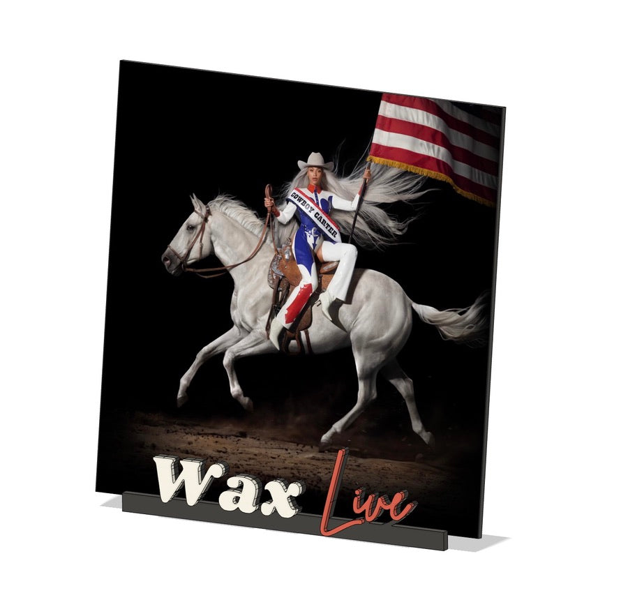 Glass print with a rider on a horse and American flag, featuring the text 'Wax Live'.
